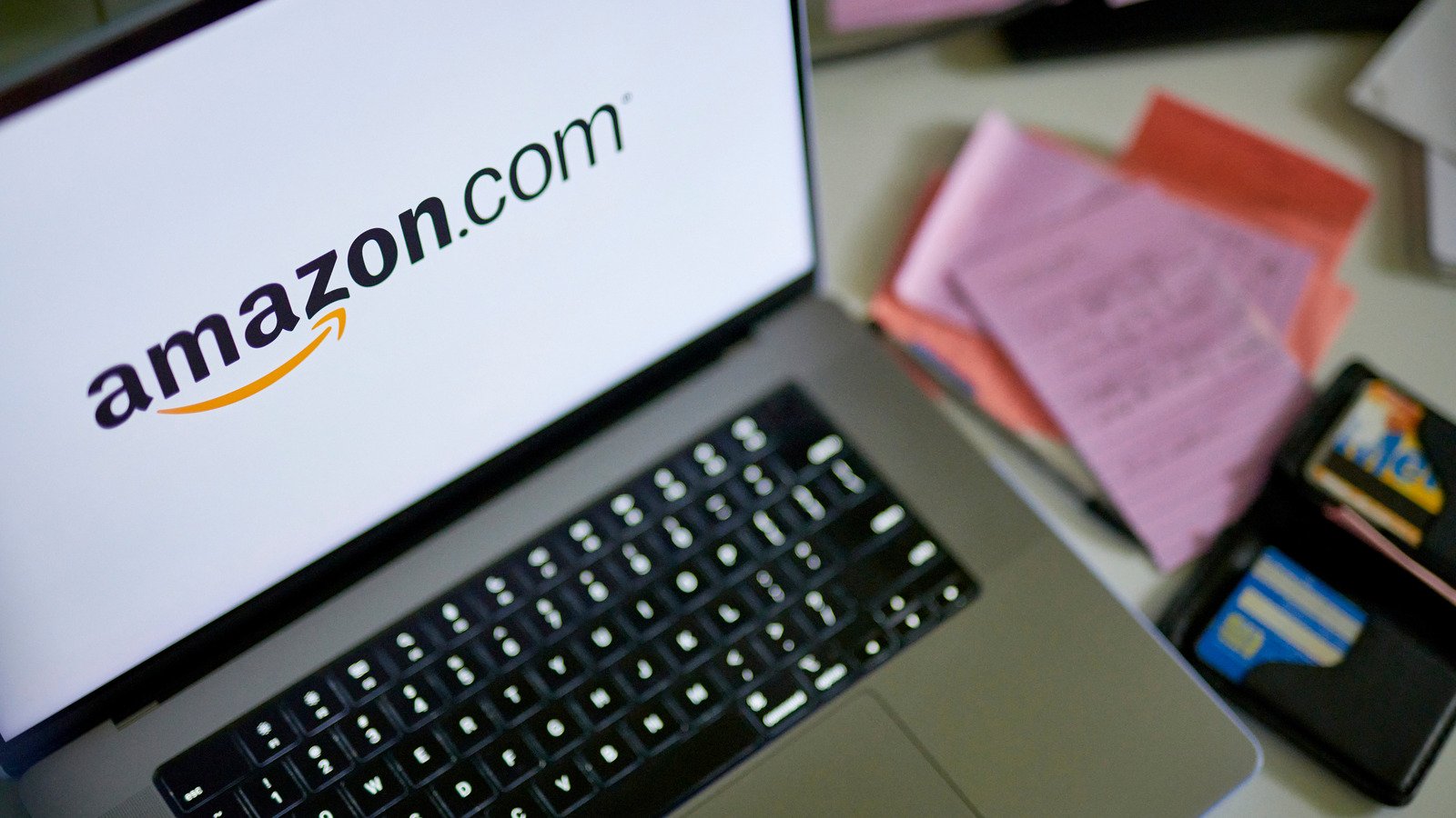 The Amazon.com logo on a laptop arranged in New York, US, on Tuesday, Sept. 26, 2023. The US Federal Trade Commission sued Amazon.com Inc. in a long-anticipated antitrust case, accusing the e-commerce giant of monopolizing online marketplace services by degrading quality for shoppers and overcharging sellers. Photographer: Gabby Jones/Bloomberg via Getty Images